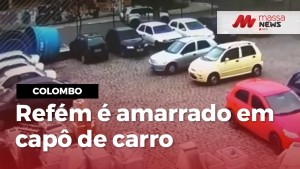 Vídeo mostra refém de assalto a banco amarrado em capô de carro