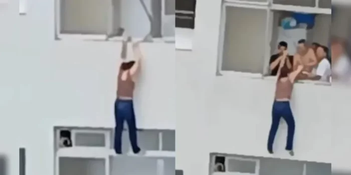 Assustador! Mulher escorrega e fica pendurada em prédio